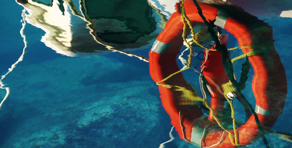 Life Buoy Reflection On The Sea Water Life Buoy Reflection On The Sea Water