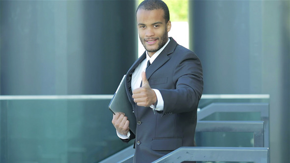 A Successful Businessman Showing Thumb Up A Successful Businessman Showing Thumb Up