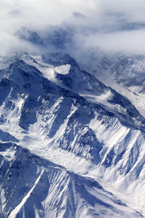 Top view on snow mountains and glacier in fog (Misc) Photo Download