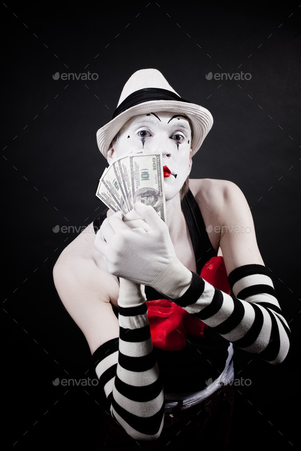 Theatrical mime with dollars in their hands (Misc) Photo Download