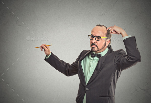 Confused teacher scratching his head (Misc) Photo Download