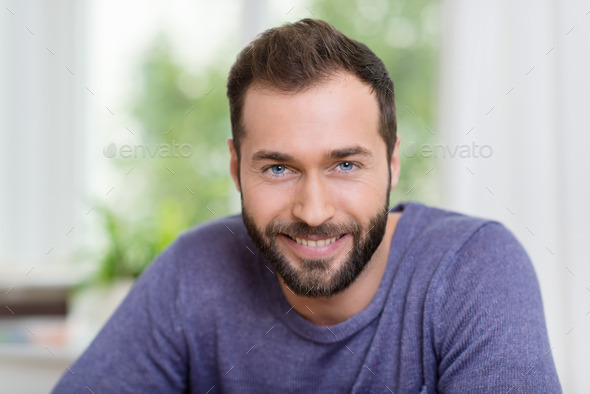Portrait of a smiling bearded man