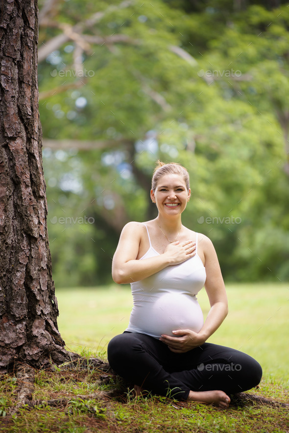 pregnant woman belly yoga meditating tree park (Misc) Photo Download