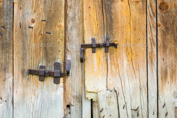 vintage wrought bars on wooden barn doors