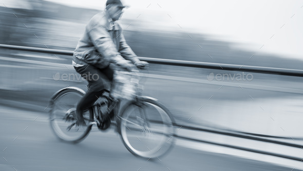 Abstract image of cyclist on the city roadway
