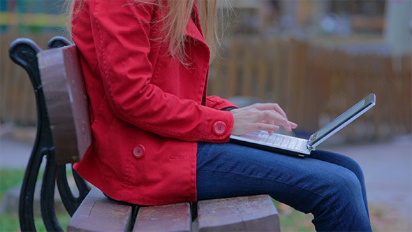 Woman Working on the Laptop in the Park Woman Working on the Laptop in the Park