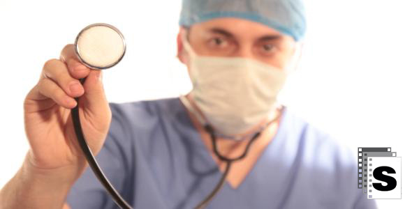 Surgeon Using Stethoscope Surgeon Using Stethoscope