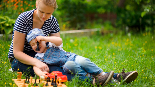 Mother And Son Spending Time On The Lawn Mother And Son Spending Time On The Lawn