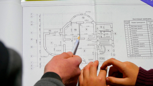 Teen Explaining Architectural Plan To His Brother Teen Explaining Architectural Plan To His Brother