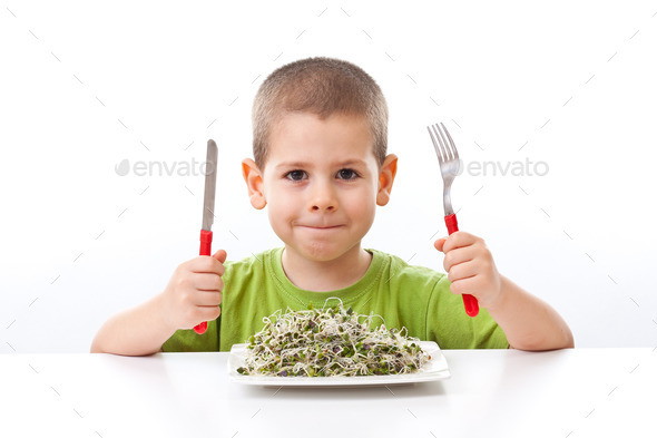 Kid taking green food (Misc) Photo Download