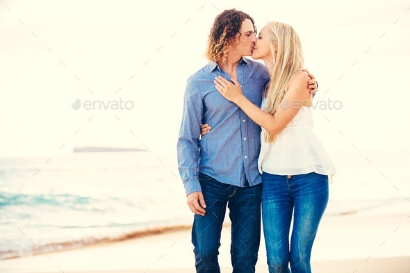 Romantic Young Couple Walking on the Beach (Misc) Photo Download