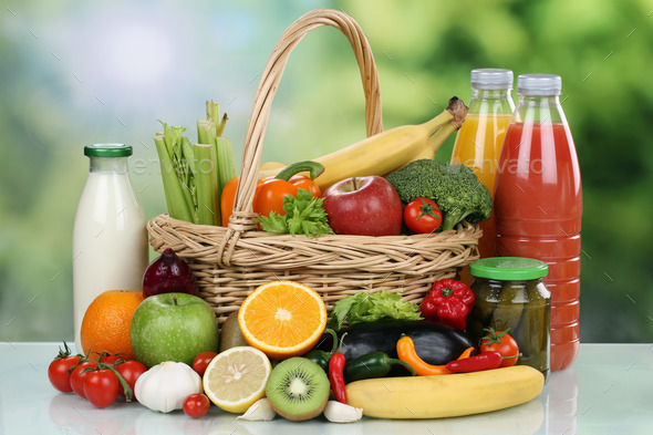 Fruits, vegetables and beverages in a shopping basket