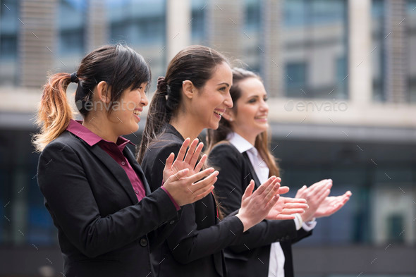 3 Business women clapping
