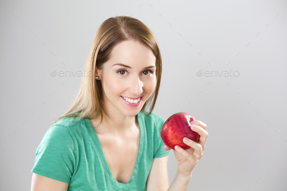 Beautiful girl with apple