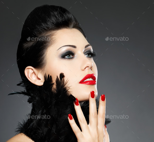 Woman with red nails and creative hairstyle