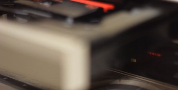 Inserting a Tape into a DV Cassette Deck Inserting a Tape into a DV Cassette Deck
