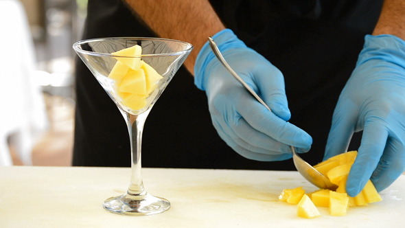 Professional Hands Preparing a Cocktail Professional Hands Preparing a Cocktail
