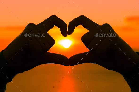 Horizontal image of two hands forming a heart symbol (Misc) Photo Download