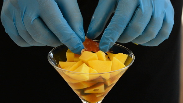 Professional Chef Hands Preparing a Cocktail Professional Chef Hands Preparing a Cocktail