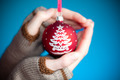 Photo of holding blue Christmas ball | Free christmas images