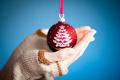 Photo of holding blue Christmas ball | Free christmas images