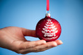 Photo of holding blue Christmas ball | Free christmas images
