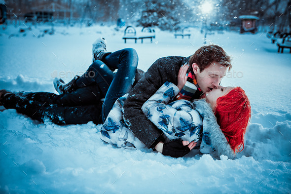 Happy Young Couple in Winter Park having fun.Family Outdoors. love kiss (Misc) Photo Download