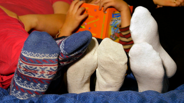 Familys Feet In Socks Over The Covers Familys Feet In Socks Over The Covers