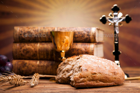 Sacred objects, bible, bread and wine.