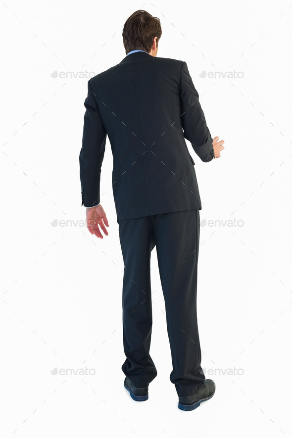 Rear view of businessman opening a door on white bakcground (Misc) Photo Download