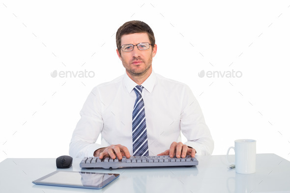 Businessman working at his desk on white background (Misc) Photo Download