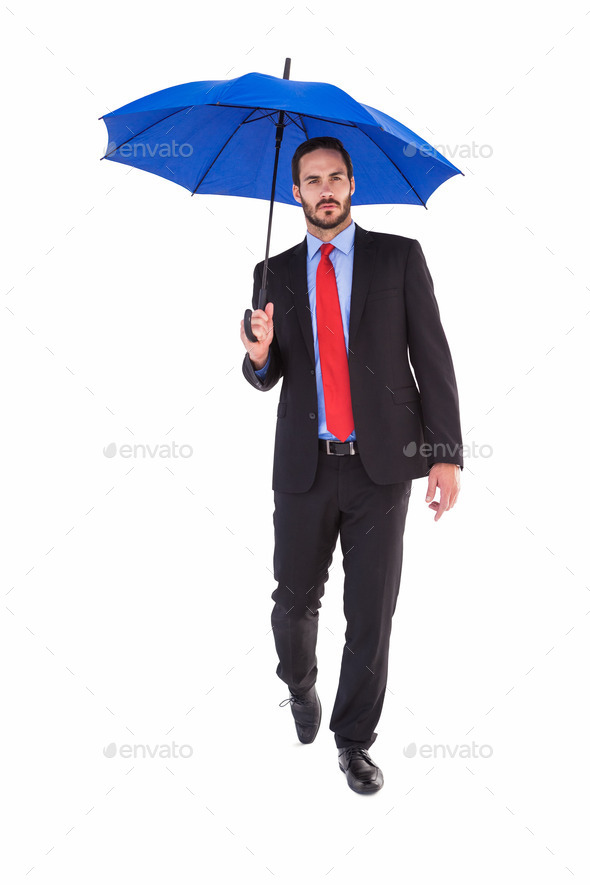 Unsmiling businessman holding an umbrella on white background (Misc) Photo Download