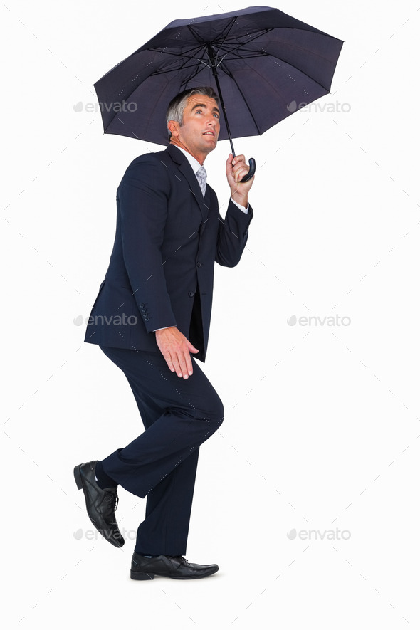 Businessman in suit standing under umbrella on white background (Misc) Photo Download