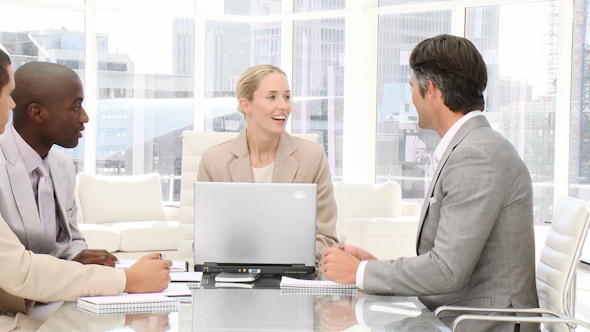 Smiling Business People in a Meeting Smiling Business People in a Meeting