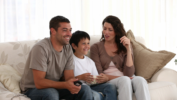 Family Watching Television on The Sofa Family Watching Television on The Sofa