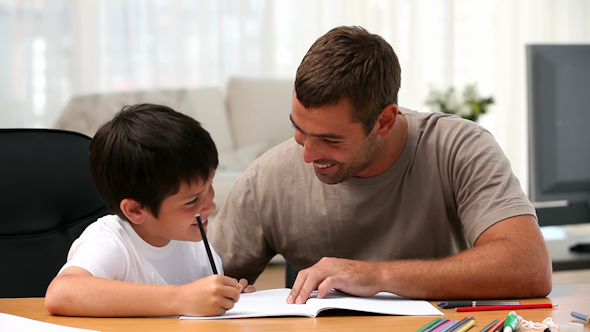 Father and Son Doing Homework Father and Son Doing Homework