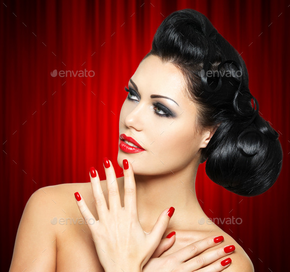 fashion woman with red lips, nails and creative hairstyle