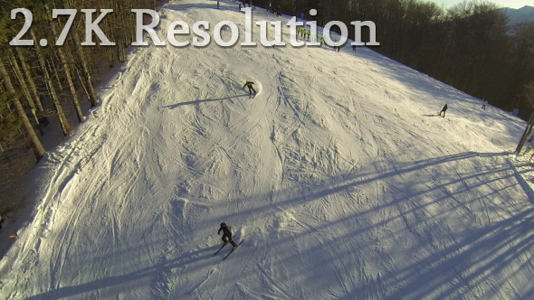 Flying over Skiers on Snowy Slope Flying over Skiers on Snowy Slope