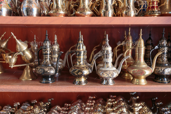 Eastern metal pitchers stand on a shelf in an Arab shop (Misc) Photo Download