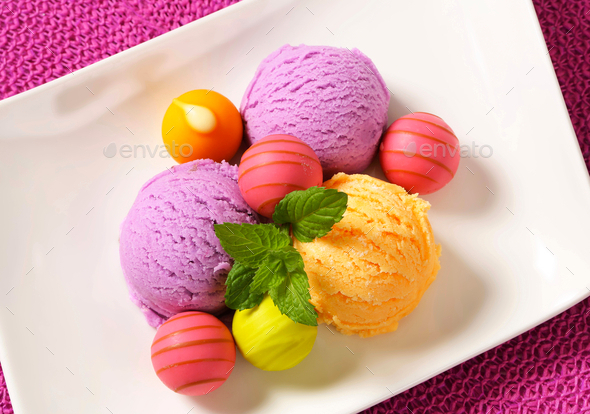 Fruit-flavored ice cream and white chocolate bonbons with fruit ganache filling