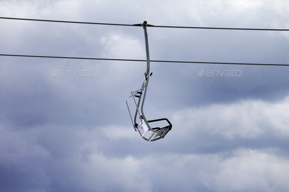 Chair-lift and overcast gray sky