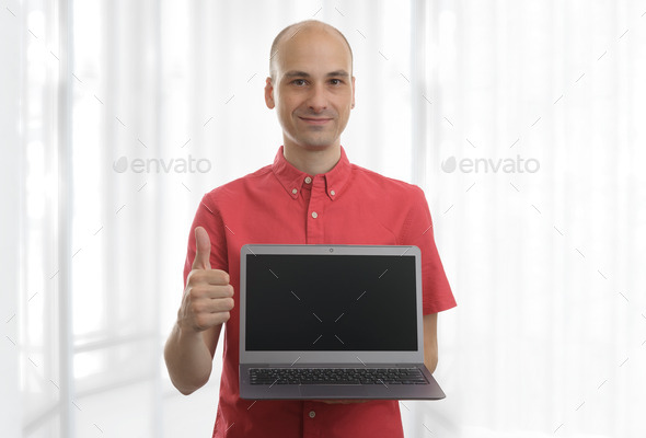 smiling bald man with laptop (Misc) Photo Download