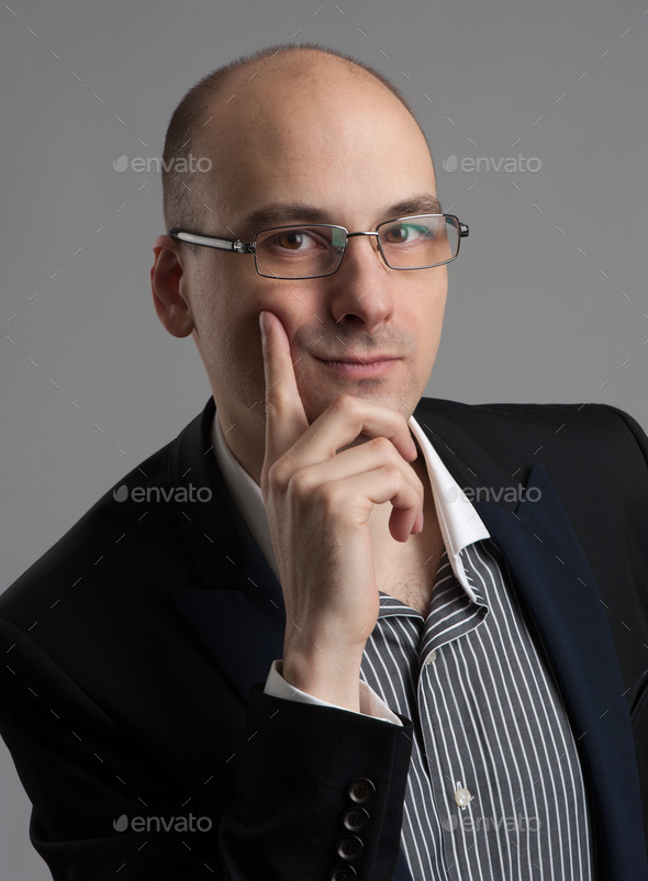 thoughtful businessman wearing glasses (Misc) Photo Download