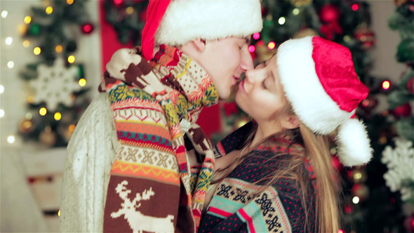 VideoHive Attractive Couple In Santa Hat And Waving Sparkler 9714040 VideoHive Attractive Couple In Santa Hat And Waving Sparkler 9714040