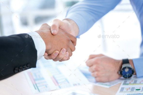 Men shaking hands. Confident businessman shaking hands with each