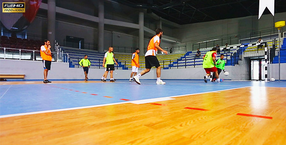 Playing Football in Indoor Sports Facility Playing Football in Indoor Sports Facility