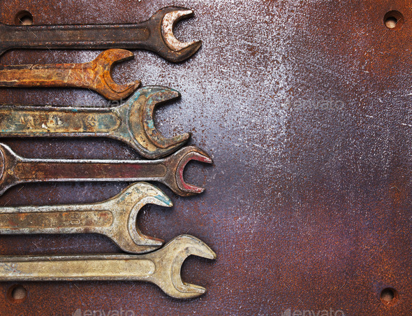 Old wrenches on a metal table