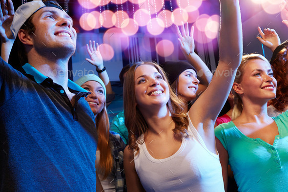 smiling friends at concert in club (Misc) Photo Download