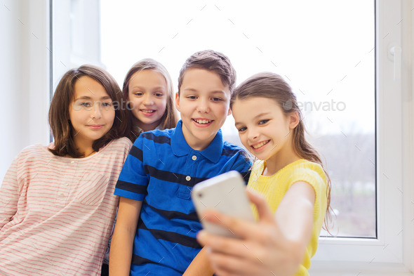 group of school kids taking selfie with smartphone (Misc) Photo Download