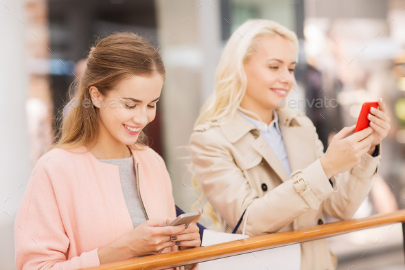 happy women with smartphones and shopping bags (Misc) Photo Download